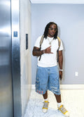 WINNINGWITHOUTYOU distressed denim shorts shown in a full-body lifestyle fit photo
